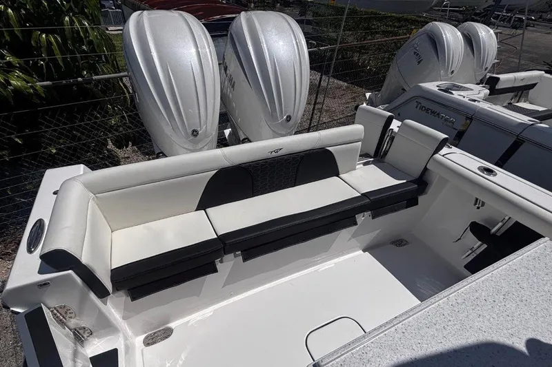 Slide: The Image of 2026 Tidewater 272 LXF boat with dual engines and spacious seating area. - 16