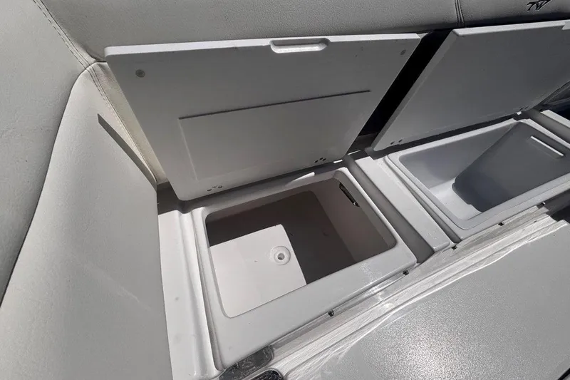Slide: The Image of Open storage compartments on a 2026 Tidewater 272 LXF boat. - 19