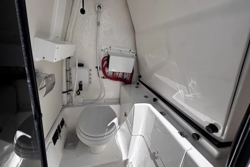 Slide: The Image of 2026 Tidewater 272 LXF boat interior bathroom with modern fixtures and compact design. - 34