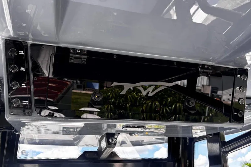 Slide: The Image of 2026 Tidewater 272 LXF boat dashboard with control panel and switches. - 40