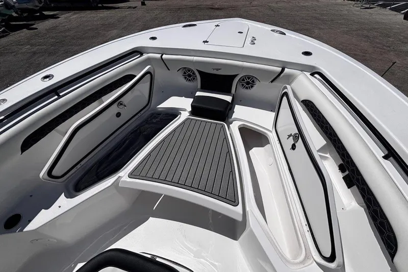 Slide: The Image of 2026 Tidewater 272 LXF boat interior with seating and storage compartments. - 42