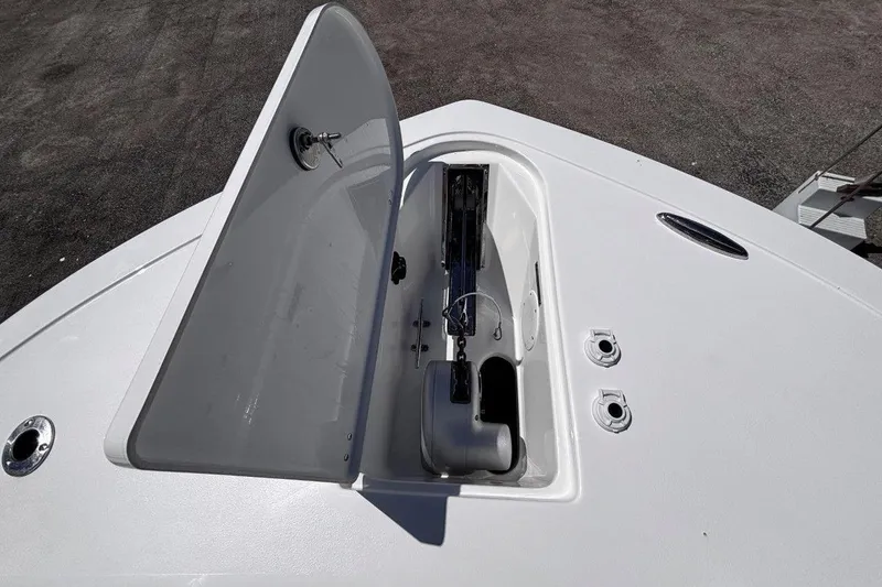Slide: The Image of Open hatch on 2026 Tidewater 272 LXF boat deck, showing storage compartment. - 45