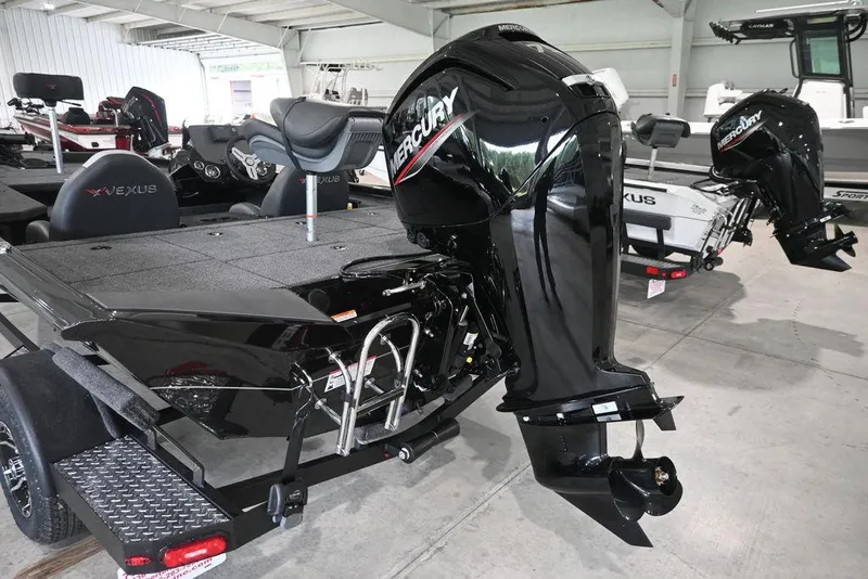 Slide: The Image of 2026 Vexus AVX181 DEFENDER boat with Mercury outboard motor in showroom. - 10