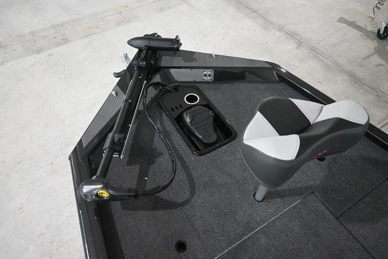 Slide: The Image of 2026 Vexus AVX181 DEFENDER boat interior with seat and trolling motor. - 11