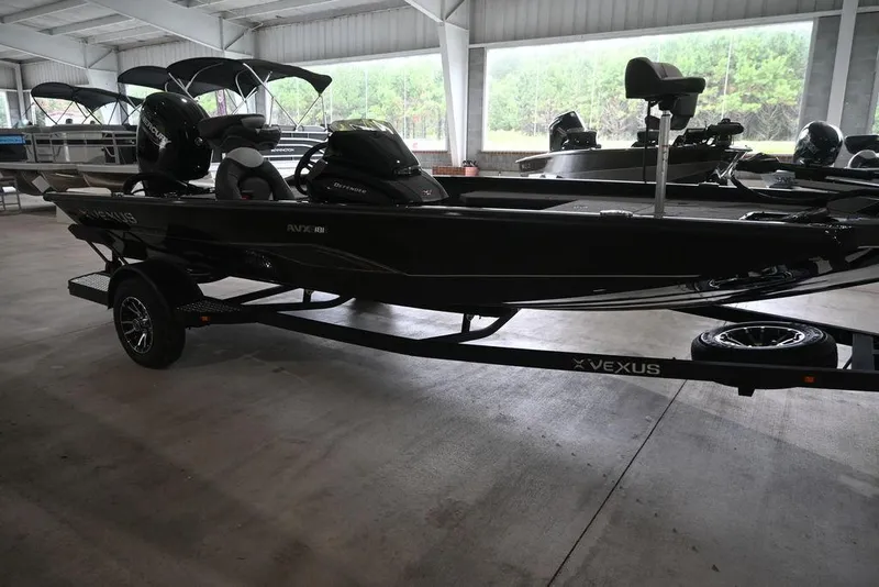 Slide: The Image of 2026 Vexus AVX181 DEFENDER boat on trailer in showroom. - 4