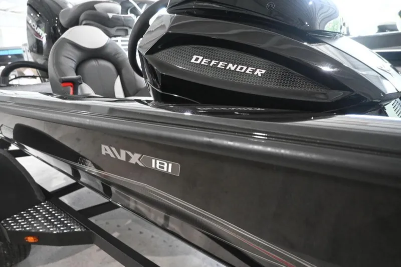 Slide: The Image of 2026 Vexus AVX181 DEFENDER boat, sleek black design with comfortable seating. - 6