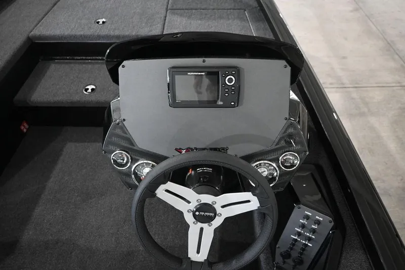 Slide: The Image of 2026 Vexus AVX181 DEFENDER boat dashboard with steering wheel and control panel. - 7