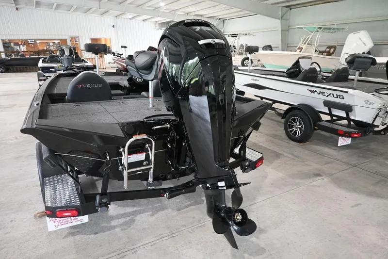 Slide: The Image of 2026 Vexus AVX181 DEFENDER boat with Mercury engine in showroom. - 8