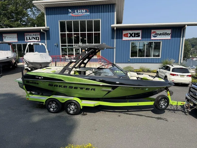 Slide: The Image of 2015 Malibu 22 VLX Wakesetter boat on trailer at Lake Hopatcong Marine dealership. - 1