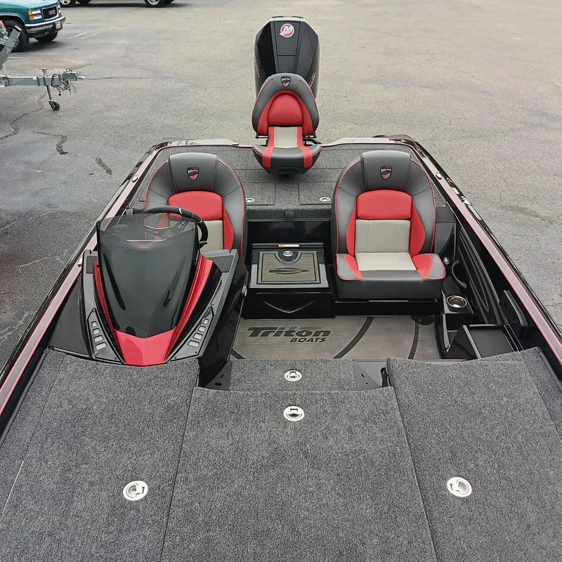 Slide: The Image of 2025 Triton 20XP boat interior with red and gray seating, sleek design, and spacious layout. - 11