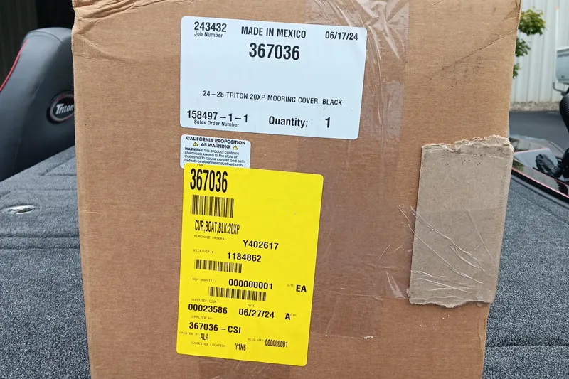 Slide: The Image of Cardboard box labeled for 2025 Triton 20XP mooring cover, made in Mexico. - 15