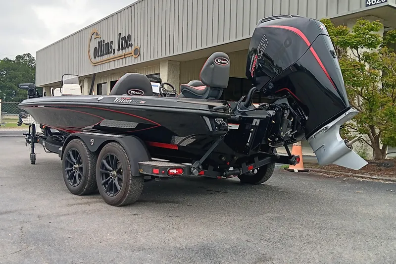 Slide: The Image of 2025 Triton 20XP boat with powerful engine, parked outside Collins Inc. building. - 6