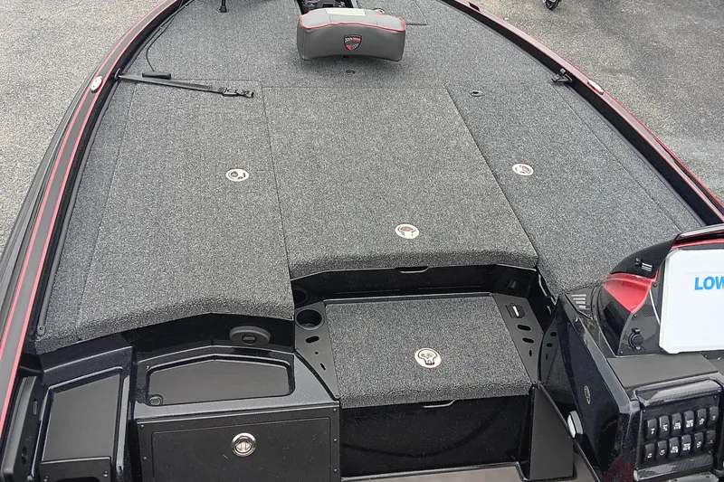 Slide: The Image of 2025 Triton 20XP boat deck with storage compartments and control panel. - 9
