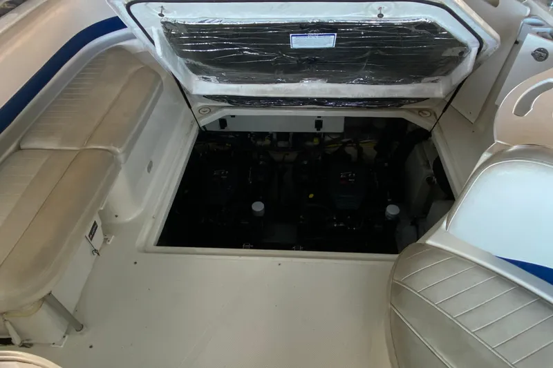 Slide: The Image of 2005 Bayliner 325 boat interior showing engine compartment and seating area. - 10