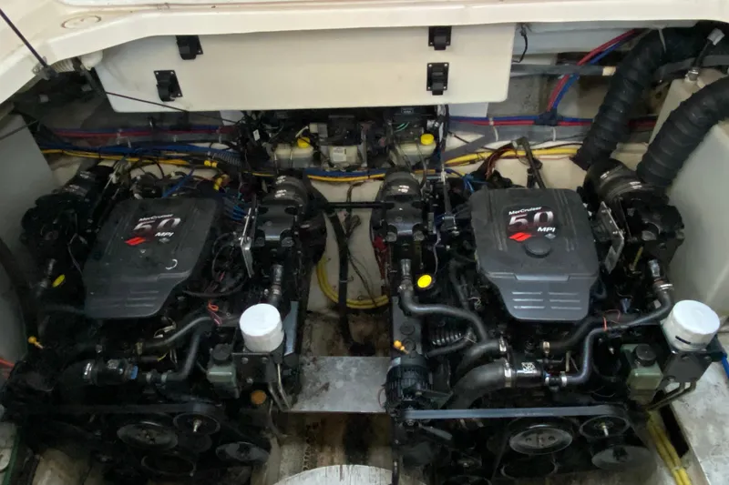 Slide: The Image of Twin MerCruiser engines in a 2005 Bayliner 325 boat engine compartment. - 13