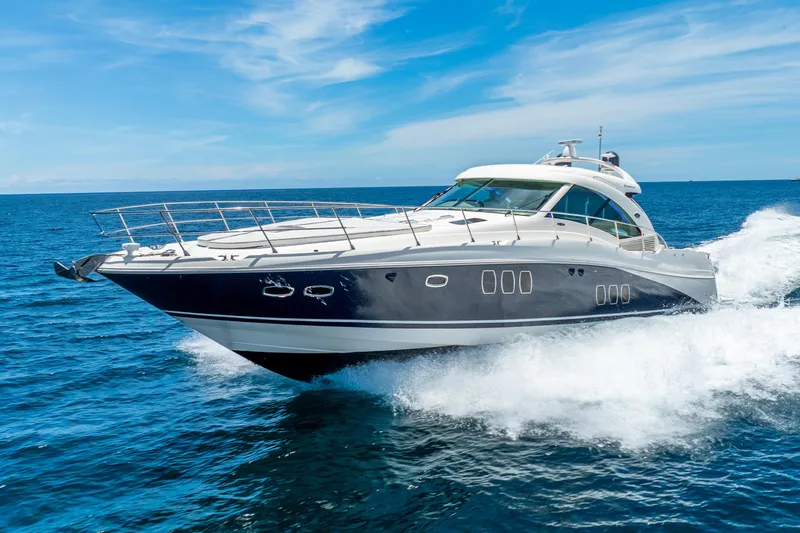 The Image of 2008 Sea Ray 60 Sundancer yacht cruising on open blue ocean. - 0