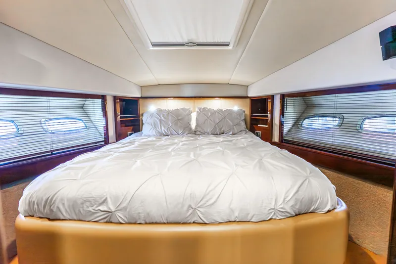 Slide: The Image of Luxurious bedroom interior of 2008 Sea Ray 60 Sundancer yacht with plush bedding. - 13