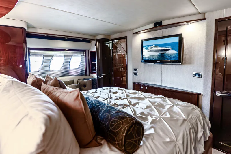 Slide: The Image of Luxurious bedroom interior of 2008 Sea Ray 60 Sundancer yacht with TV and elegant bedding. - 18