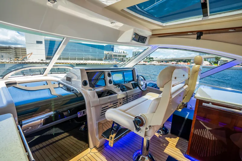 Slide: The Image of Luxurious helm of 2008 Sea Ray 60 Sundancer yacht with modern controls and waterfront view. - 32