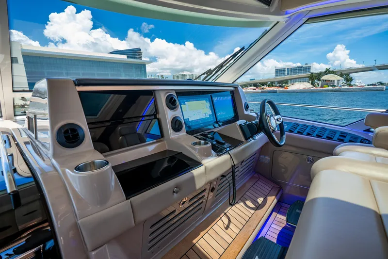 Slide: The Image of Helm of 2008 Sea Ray 60 Sundancer yacht with modern navigation equipment and luxurious seating. - 36
