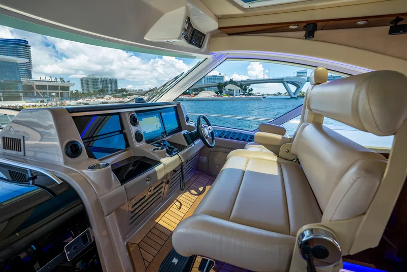 Slide: The Image of Luxurious 2008 Sea Ray 60 Sundancer yacht interior with leather seating and modern navigation controls. - 37