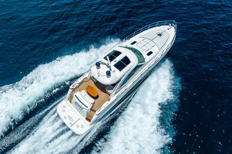 Slide: The Image of 2008 Sea Ray 60 Sundancer yacht cruising on open blue water. - 4