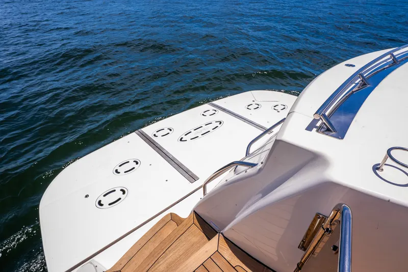 Slide: The Image of 2008 Sea Ray 60 Sundancer yacht stern with swim platform on open water. - 42
