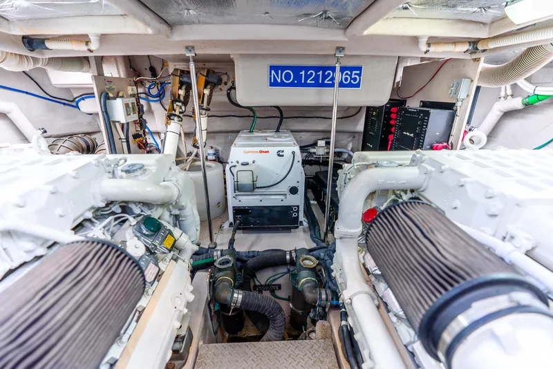 Slide: The Image of Engine room of 2008 Sea Ray 60 Sundancer with Cummins Onan generator and mechanical components. - 46