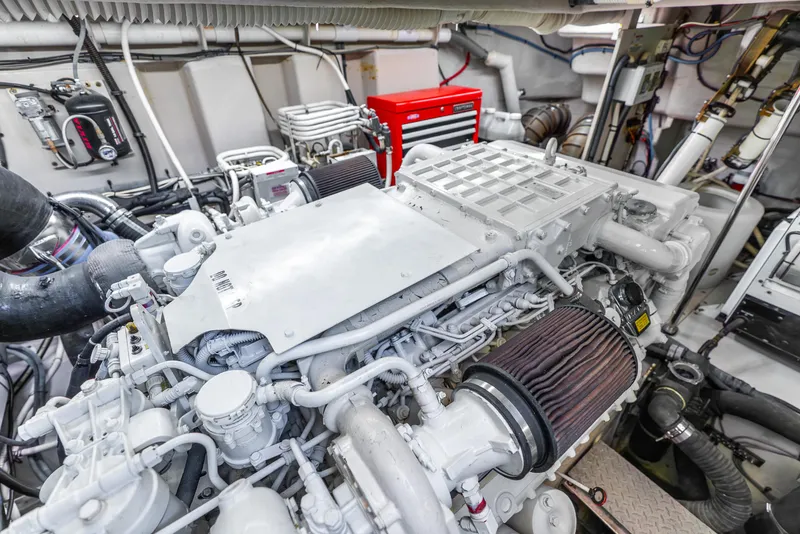 Slide: The Image of Engine room of 2008 Sea Ray 60 Sundancer yacht, showcasing detailed machinery and components. - 47