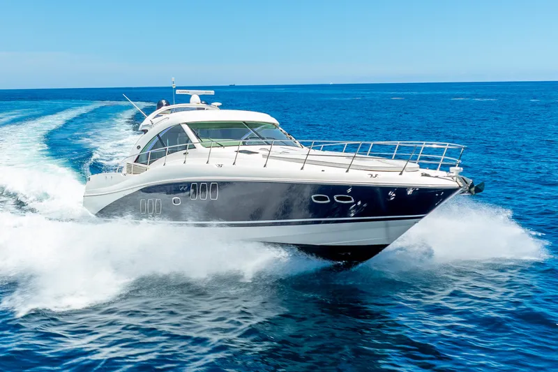 Slide: The Image of 2008 Sea Ray 60 Sundancer yacht cruising on open blue ocean. - 8
