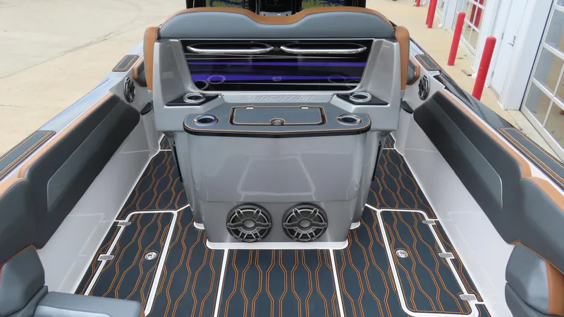 Slide: The Image of 2023 Sunsation 32 CCX boat interior with modern seating and stylish flooring design. - 10