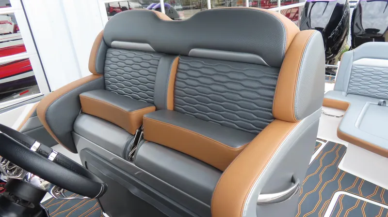 Slide: The Image of 2023 Sunsation 32 CCX boat interior with luxurious leather seating and modern design. - 13