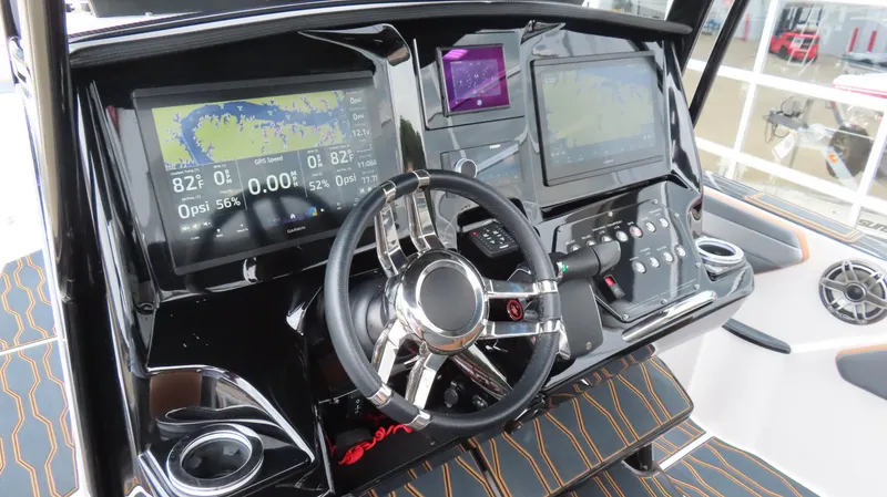 Slide: The Image of 2023 Sunsation 32 CCX boat dashboard with advanced navigation and control systems. - 15