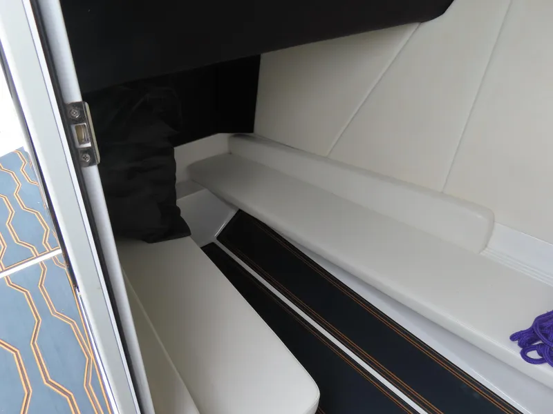 Slide: The Image of 2023 Sunsation 32 CCX cabin interior with white seating and geometric flooring. - 25