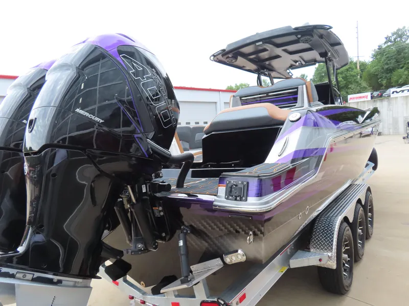 Slide: The Image of 2023 Sunsation 32 CCX boat with dual Mercury 400R engines on a trailer. - 5