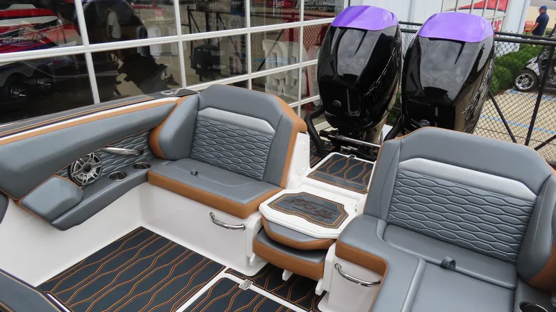 Slide: The Image of 2023 Sunsation 32 CCX boat interior with stylish seating and dual outboard engines. - 9