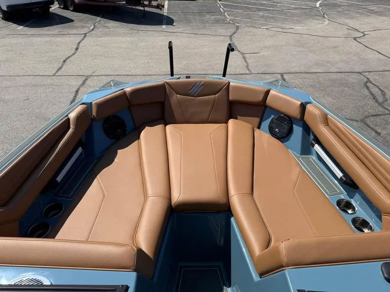 Slide: The Image of 2026 ATX Surf Boats 22 Type-S interior with tan seating and cup holders. - 13
