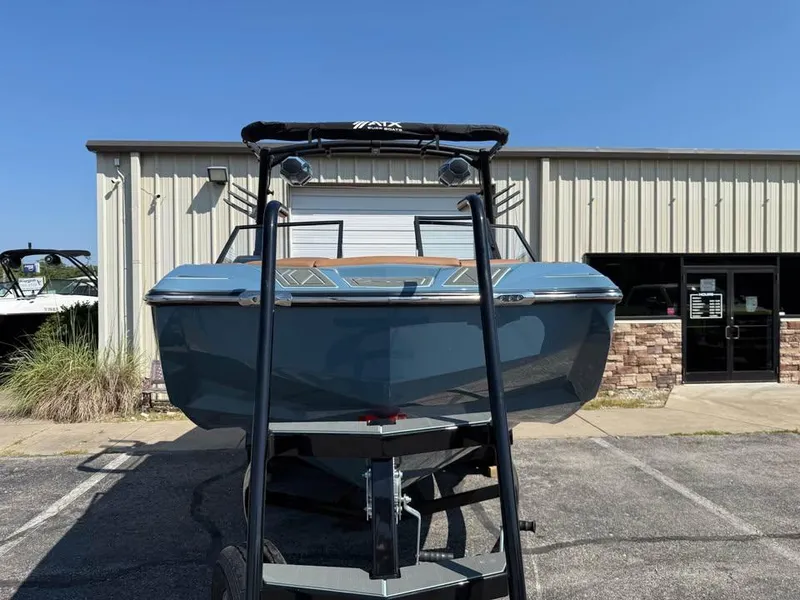 Slide: The Image of 2026 ATX Surf Boats 22 Type-S in front of a building, showcasing sleek design. - 2