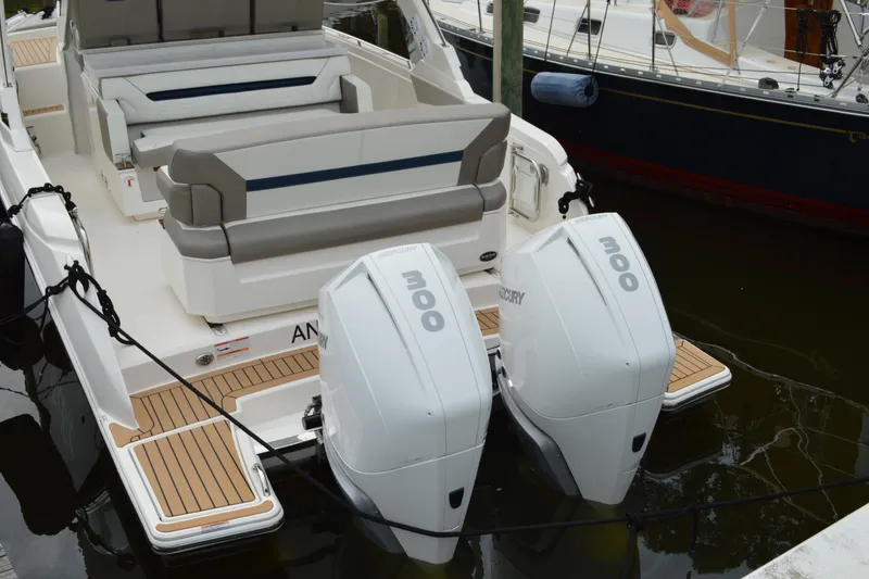 Slide: The Image of 2023 Tiara Yachts 34 LS with dual Mercury 300 engines, docked at marina. - 12