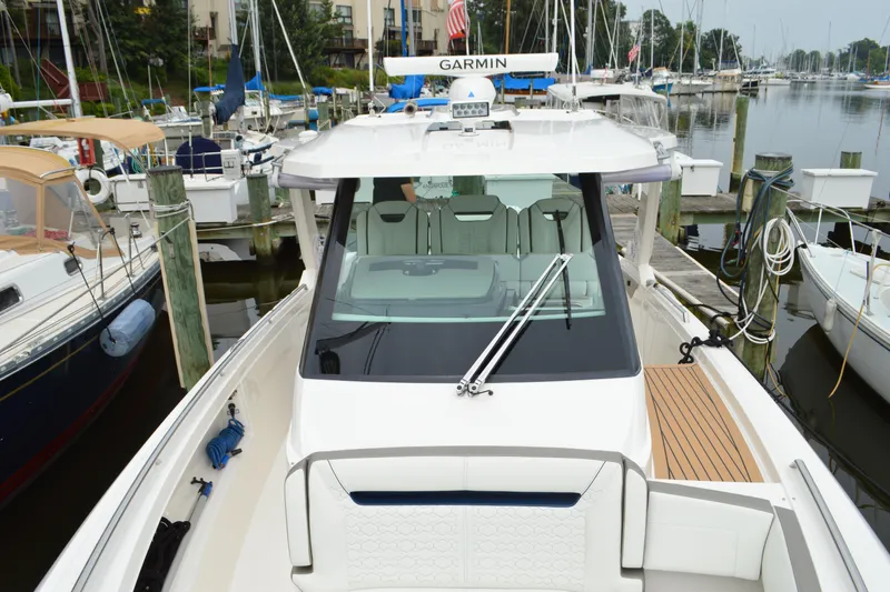 Slide: The Image of 2023 Tiara Yachts 34 LS docked at marina, featuring sleek design and modern amenities. - 13