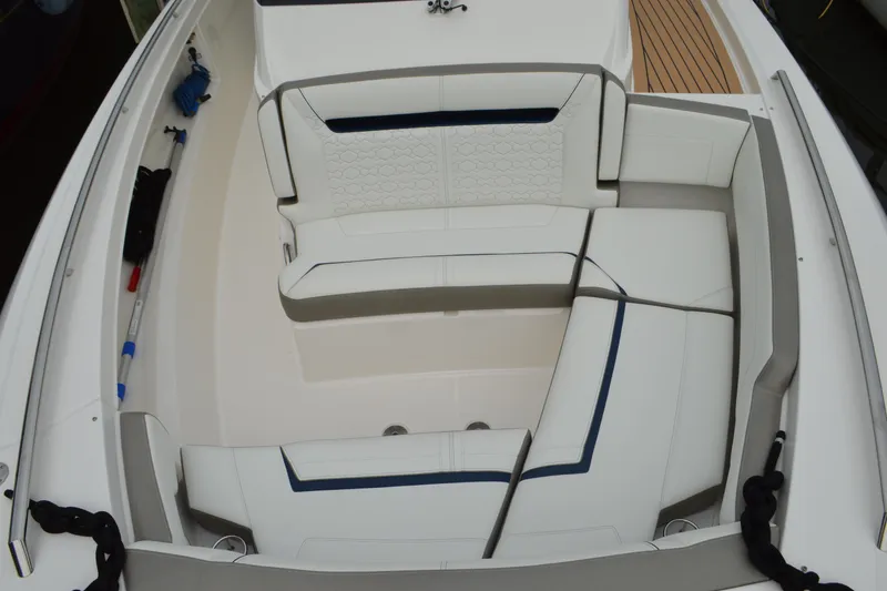 Slide: The Image of 2023 Tiara Yachts 34 LS boat interior with white cushioned seating. - 15