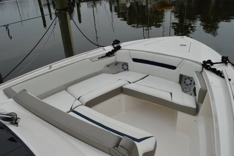 Slide: The Image of Luxurious seating area on 2023 Tiara Yachts 34 LS, featuring elegant white upholstery. - 16