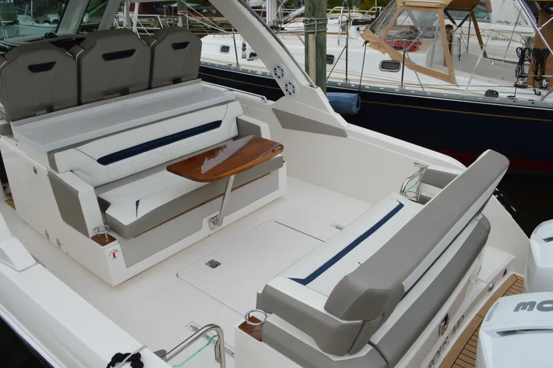 Slide: The Image of 2023 Tiara Yachts 34 LS luxury boat interior with seating and table. - 27