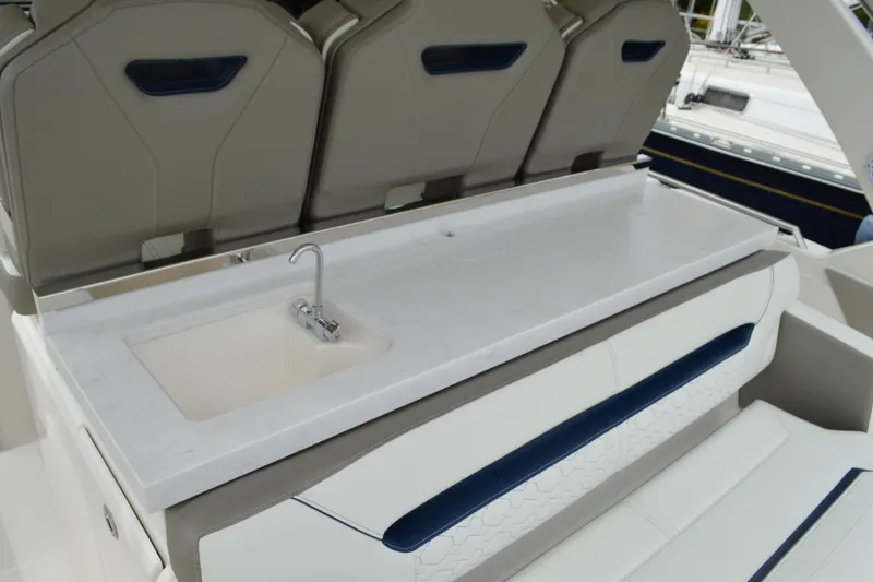 Slide: The Image of 2023 Tiara Yachts 34 LS interior with sleek sink and seating area. - 30