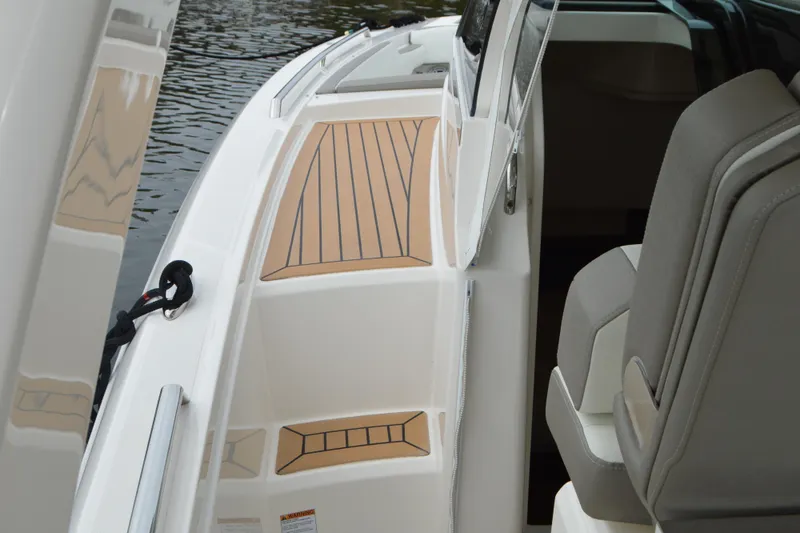 Slide: The Image of 2023 Tiara Yachts 34 LS interior with sleek seating and deck design. - 32