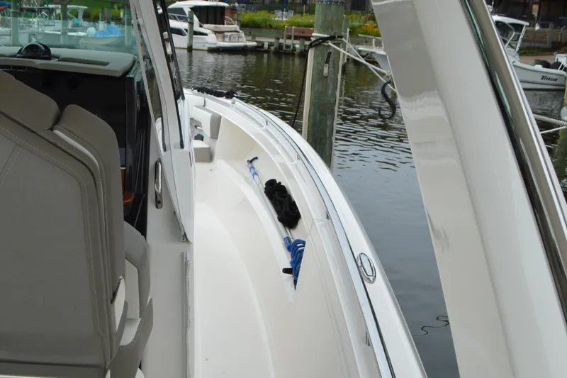 Slide: The Image of 2023 Tiara Yachts 34 LS docked, showcasing sleek design and modern features. - 33