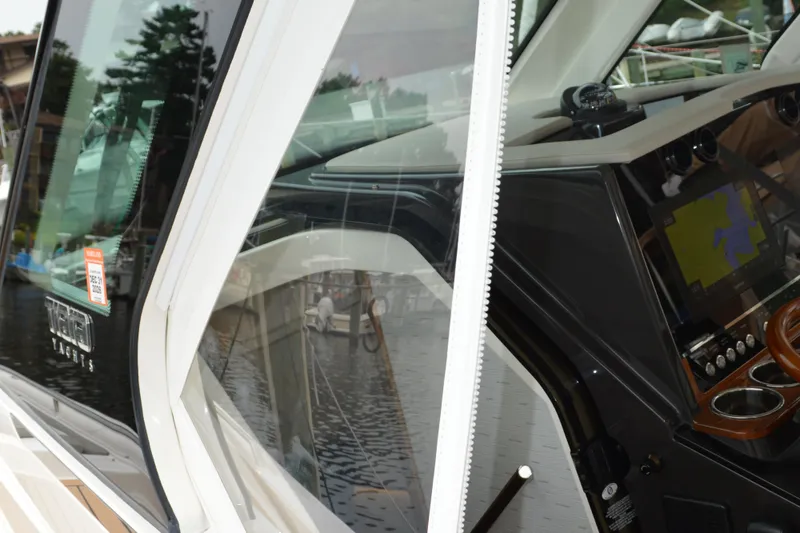 Slide: The Image of 2023 Tiara Yachts 34 LS cockpit with navigation display and sleek design. - 35
