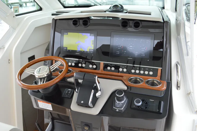 Slide: The Image of 2023 Tiara Yachts 34 LS helm with advanced navigation displays and controls. - 39