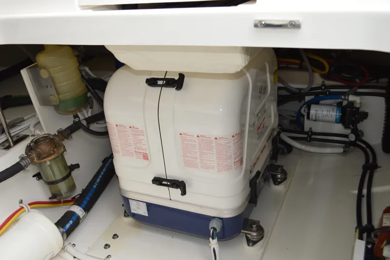Slide: The Image of Engine compartment of 2023 Tiara Yachts 34 LS, showcasing mechanical components and wiring. - 44
