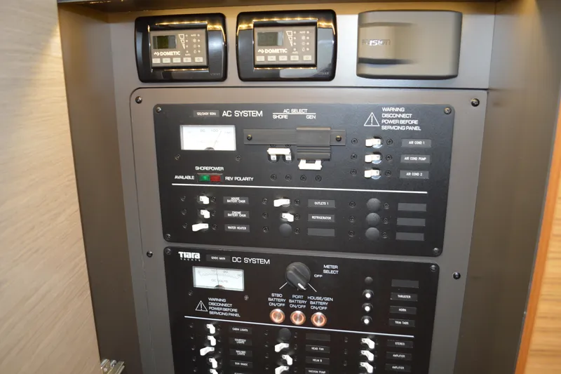 Slide: The Image of Electrical control panel on a 2023 Tiara Yachts 34 LS boat. - 49